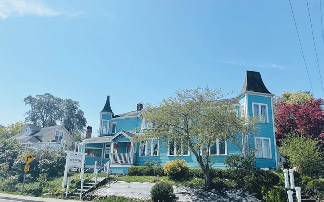 The Burton Inn, a blue Victorian house